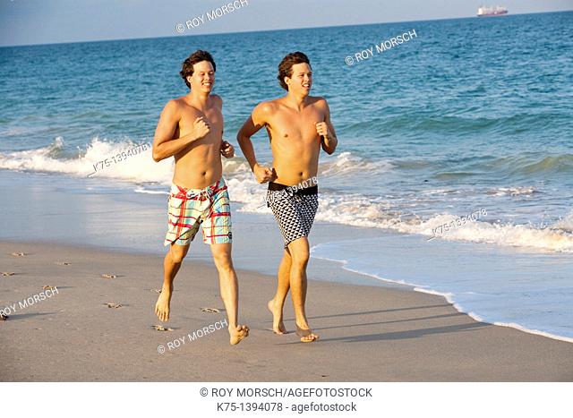 twins running on the beach