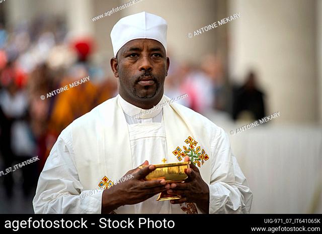 Priest holding a ciborium during Pope Francis's Holy Mass in St. Peter's Square, at the Vatican