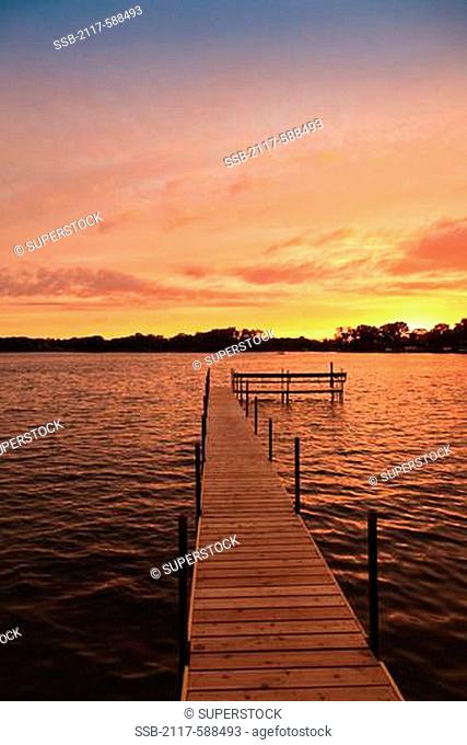 USA, Minnesota Lake, Dock and sunset