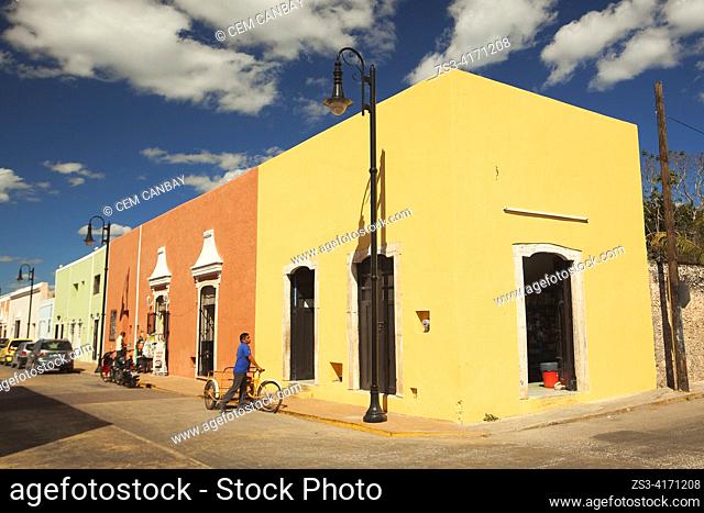 Cyclist in front of the colonial buildings at the historic center, Valladolid, Riviera Maya, Yucatan State, Mexico, Central America
