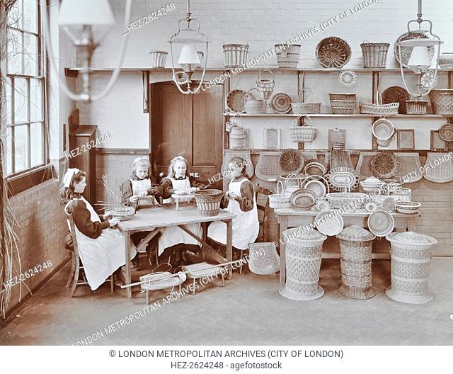 Basketry workshop at Elm Lodge Residential School for Elder Blind Girls, West Norwood, Lambeth, London, 1908. Girls work at making baskets