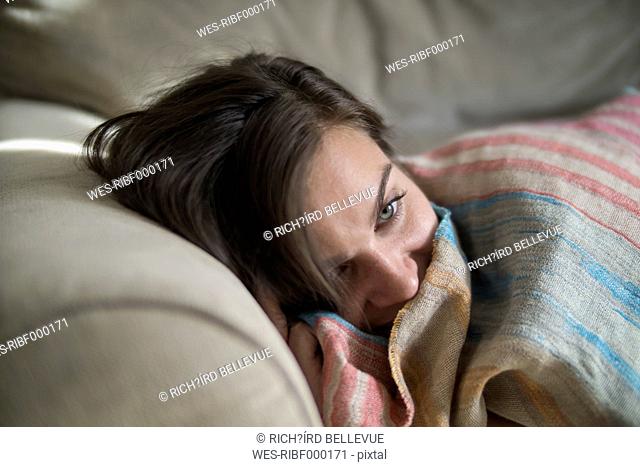 Young woman relaxing on couch