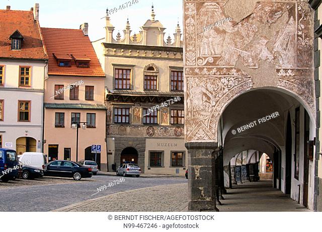 Prachitace Market Place with houses from Renaissance style and sgraffito paintings. Arcades, Bohemia. Czech Republic