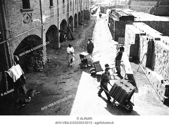 Workers to work within Galotti Furnace for the production of bricks, now home to the Museum of Industrial Heritage of Bologna, shot 1930 ca