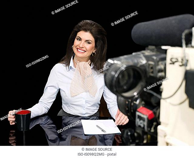 News presenter and camera