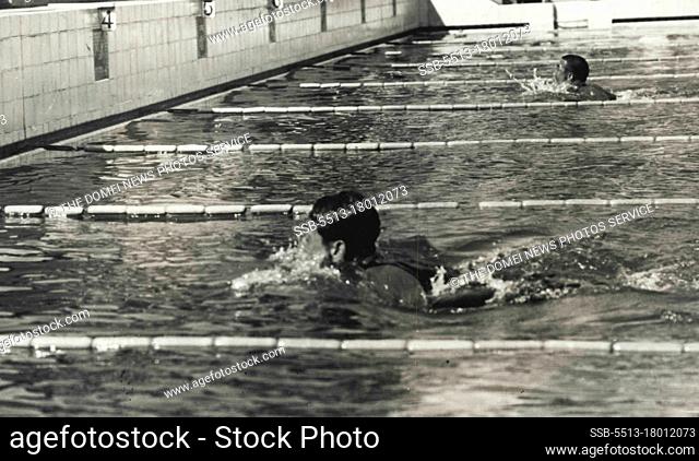 Racing for ***** at Meiji Shrine Pool.... Mr. Tetsuo Hamuro, near to the camera, is seen at learning in the 100 breast-stroke