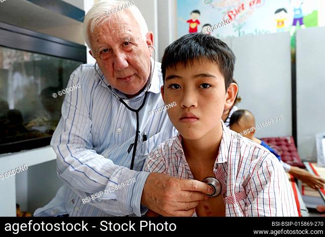 French NGO Chaine de l'Espoir. Children's pavilion. Child suffering of heart disease. Medical consultation. Pr Alain Deloche. Ho Chi Minh City