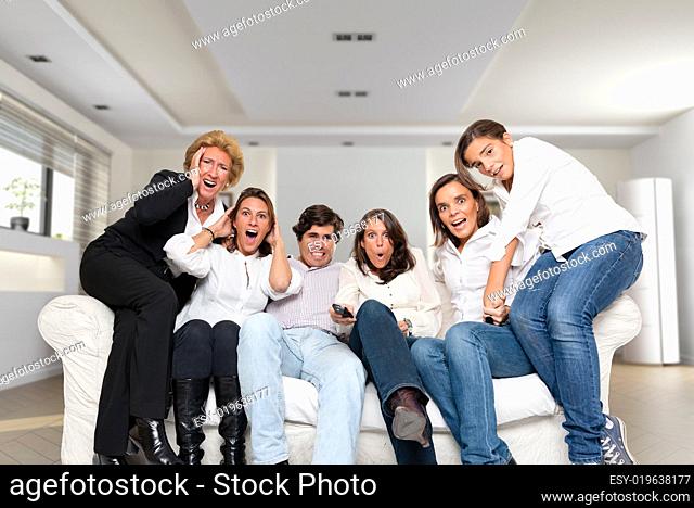 Nervous family watching tv