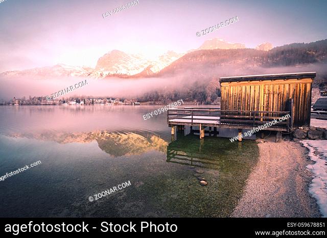 wooden pier at mountain Lake in winter at Grundlsee in Austria