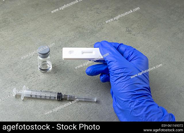 Immunization concept, rapid Covid test, mask, vaccine and rapid test