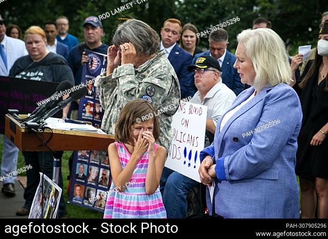 Brielle Robinson, 9, second from right, is comforted by United States Senator Kirsten Gillibrand (Democrat of New York), right