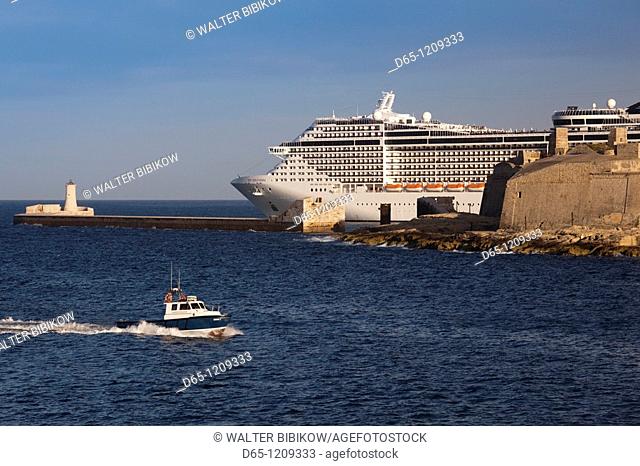 Malta, Valletta, cruise ship leaving Valletta harbor, sunset