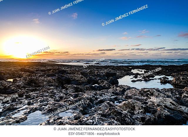 Scenic view of rocky beach at sunset, Cotillo, Fuerteventura, Canary Islands, Spain