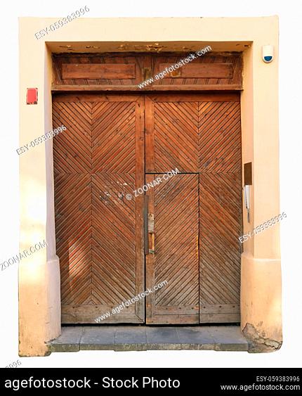 The central front wooden door to the old public medieval church. Isolated on white