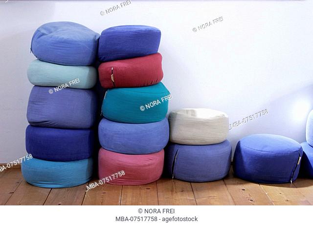 Wooden floor, pillows stack, meditation pillows