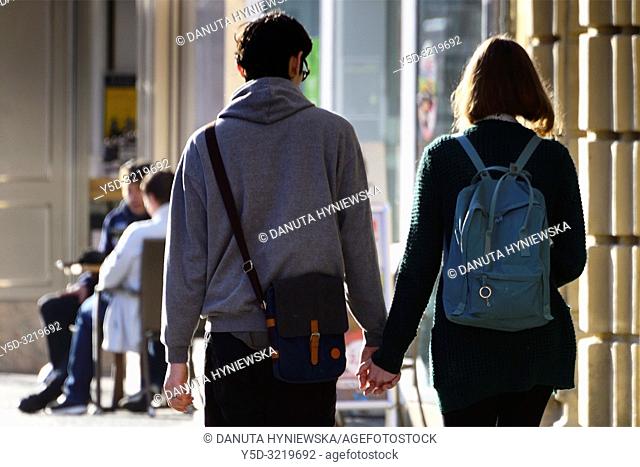 young couple walking hand in hand, street life, old town of Bayreuth, Maximilianstrasse - main touristic promenade in old town, Bayreuth