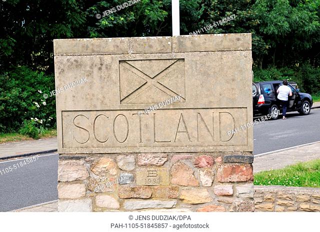 A stone sign reading ""Scotland"" is posted on the A1 at the English-Scottish border near Berwick-upon-Tweed, Britain, 11 July 2014