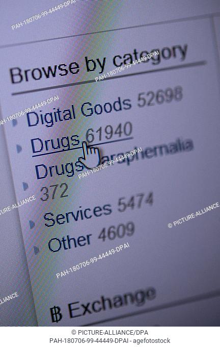 6 July 2018, Stuttgart, Germany: A cursor is placed upon the button reading ""drugs"" on a darknet webpage. Photo: Sebastian Gollnow/dpa