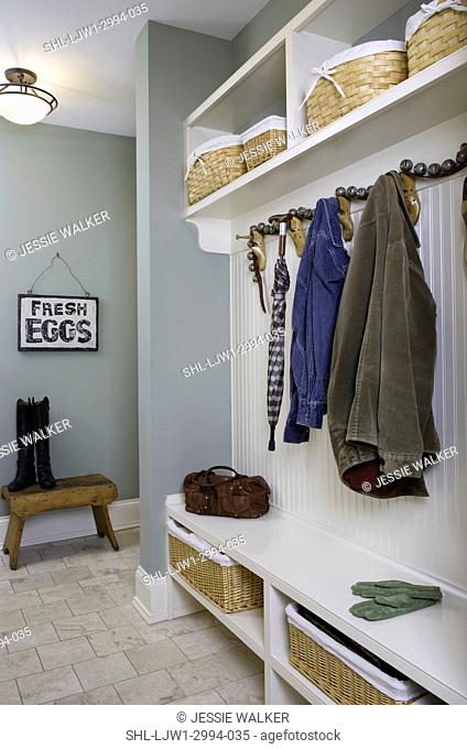 STORAGE: Back entry hall with built in storage, shelves for baskets of mittens & hats, hooks for coats, bench to sit on, sage green paint Fresh Eggs sign