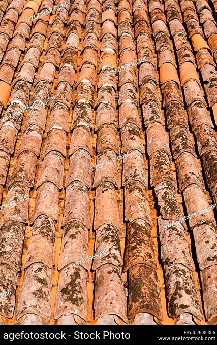 The texture of the old brown shingles on the roof of the building. High quality photo
