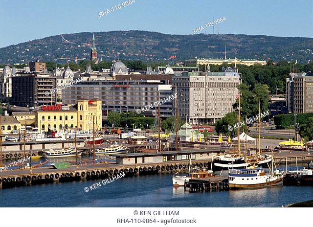 Aerial view over the harbour, including the Royal Palace and the ski slope at Holmenkollen on the hill in the distance, Oslo, Norway, Scandinavia, Europe