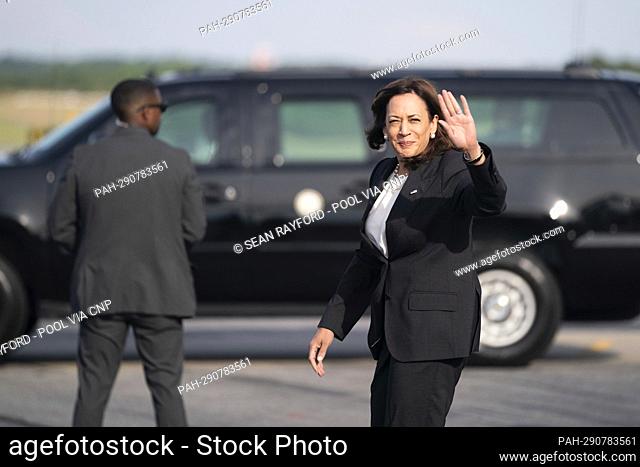 United States Vice President Kamala Harris waves to members of the media on the tarmac at Columbia Metropolitan Airport before the South Carolina Democratic...