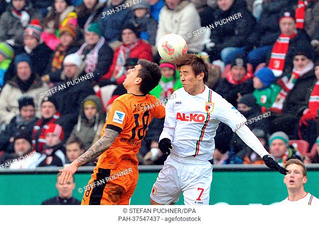 Augsburg's Ja-Cheol Koo (R) vies for the ball with Hoffenheim's Joselu during the Bundesliga soccer match between FC Augsburg and TSG 1899 Hoffenheim at...