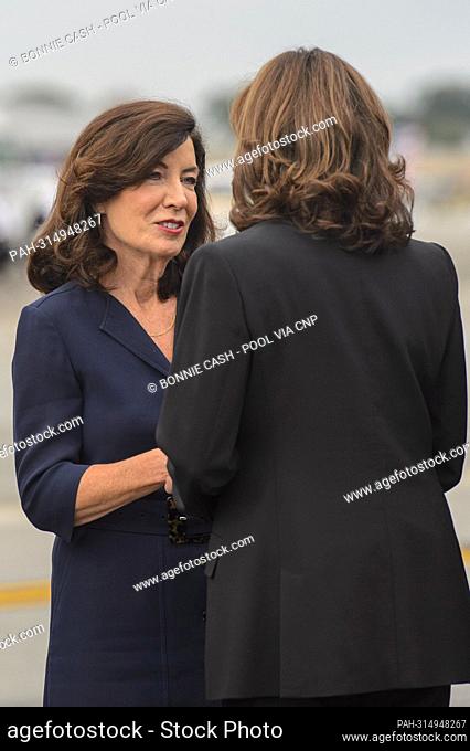 United States Vice President Kamala Harris shakes hands with Governor Kathy Hochul (Democrat of New York) as her husband, William Hochul Jr