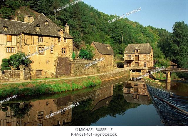 Tranquil scene of reflections in water of a millhouse near Conques, Aveyron, Midi-Pyrenees, France, Europe