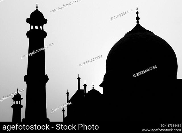 Taj Mahal backlit by the rising sun. A September view. The famous mausoleum has been built by the emperor of India Shah Jahan (Muhammad Khurram)