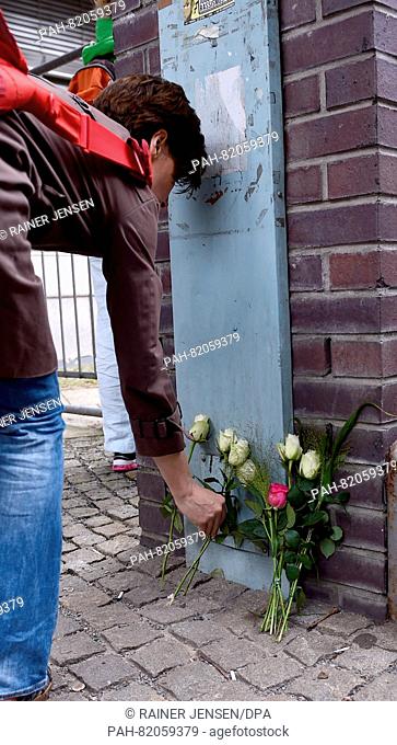 A white rose is placed in front of a building of the Paula Fuerst comprehensive school in Berlin,  Germany, 15 July 2016