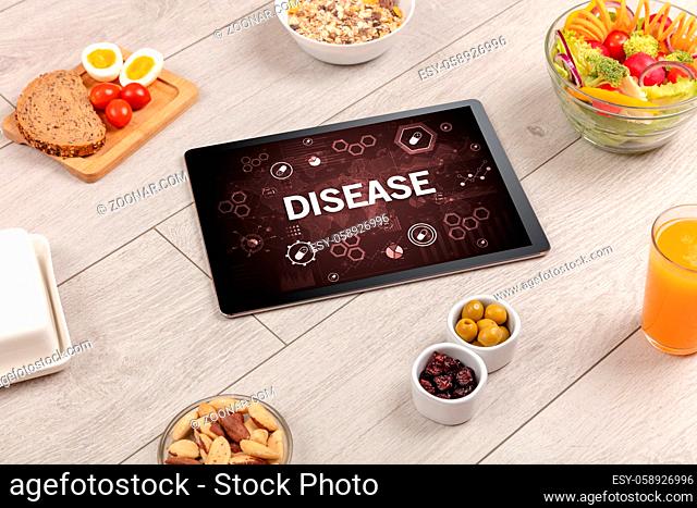 Healthy Tablet Pc compostion with DISEASE inscription, immune system boost concept