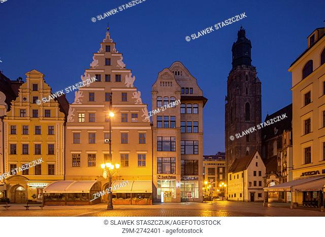 Before dawn at medieval market square in Wroclaw, Poland. St Elizabeth church tower in the distance