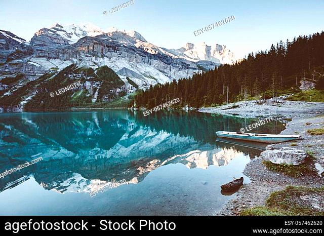 Glacier pond Oeschinensee. Popular tourist attraction. Picturesque and gorgeous scene. Location Swiss alps, Kandersteg, Bernese Oberland, Europe
