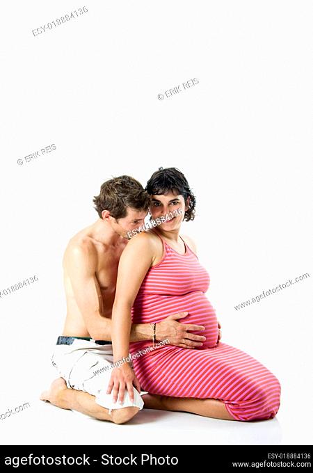 Beautiful couple in love expecting a baby - Isolated on white