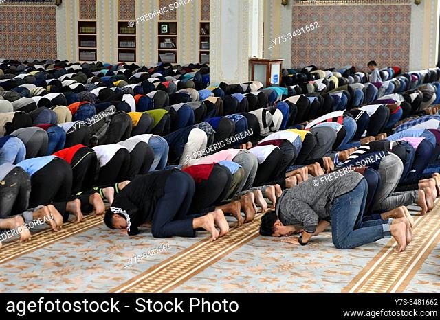 Muslim men praying at Friday prayers, Al-Serkal Mosque, Phnom Penh, Cambodia, South East Asia