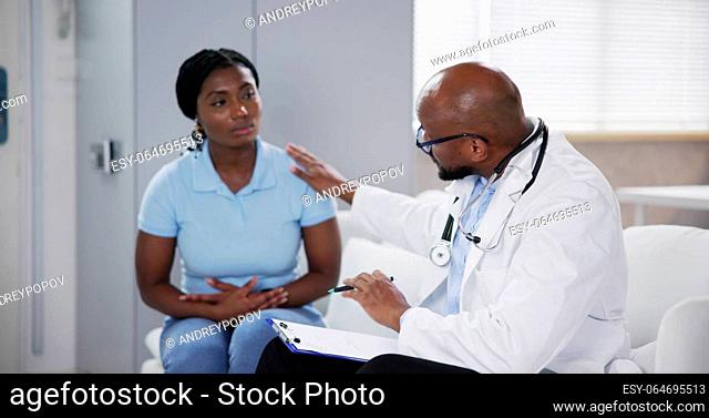 African Medical Doctor Talking To Patient. Health Service