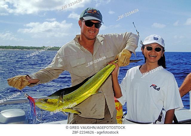 Marshall Islands, Micronesia: Fishing Guide Rod Bourke and Japanese visitor Yuki Nakako with Mahimahi caught at Bikini Atoll