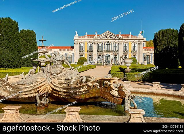 QUELUZ, SINTRA / PORTUGAL - OCOBER 02, 2017: Facade, fountain and gardens of Queluz Palace in Sintra, Portugal during summer day
