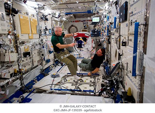 In the International Space Station's Kibo laboratory, NASA astronauts Steve Swanson (left), Expedition 40 commander; and Reid Wiseman, flight engineer