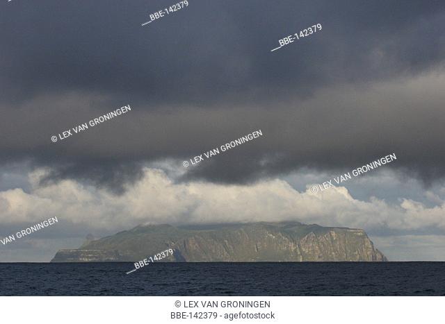 View over Inaccessible Island in the early morning when the island is still covered in clouds