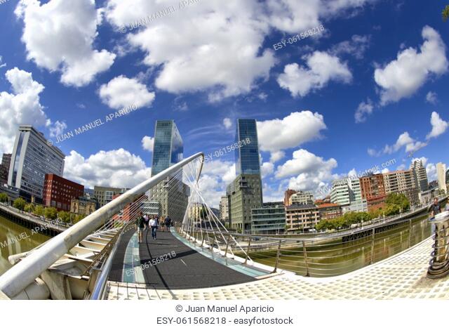 Zubizuri bridge by Santiago Calatrava and Isozaki Towers, Bilbao, Biscay, Basque Country, Euskadi, Euskal Herria, Spain, Europe