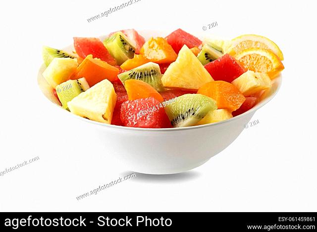 Bowl of healthy fresh tropical fruit salad on white background. Top view