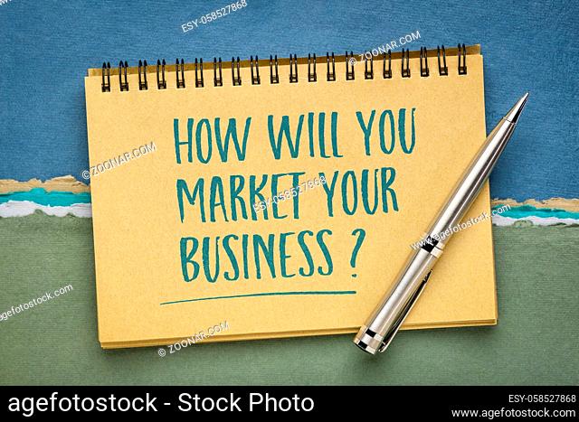 How will you market your business? Handwriting on a spiral notebook. Marketing, starting and building business concept