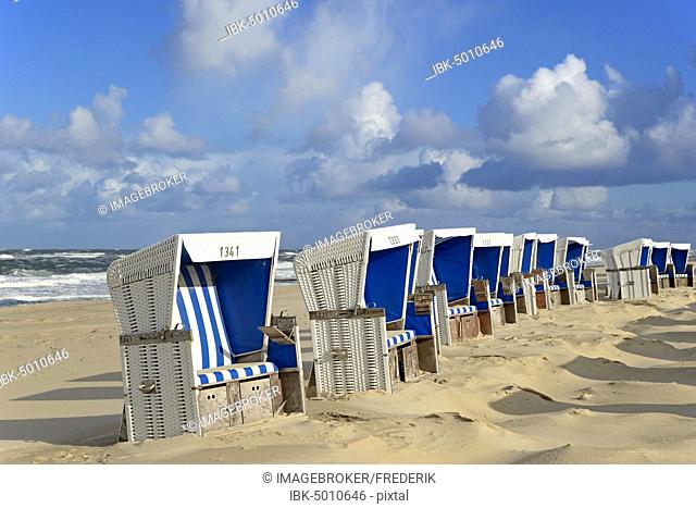White-blue beach chairs at the beach of Westerland with cloudy sky, Sylt, North Frisian Island, North Sea, North Frisia, Schleswig-Holstein, Germany, Europe