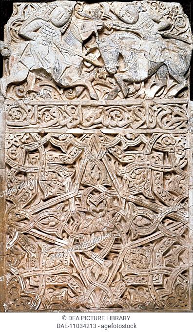 Decorative panel showing two warriors, stucco. Islamic Civilisation, 13th century.  Seattle, Seattle Art Museum
