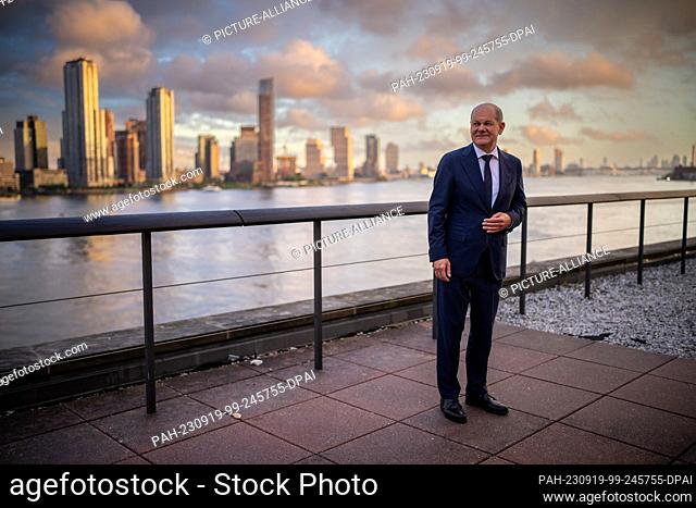 dpatop - 18 September 2023, USA, New York: Chancellor Olaf Scholz (SPD), stands on the roof terrace of the UN on the East River during the reception to mark the...