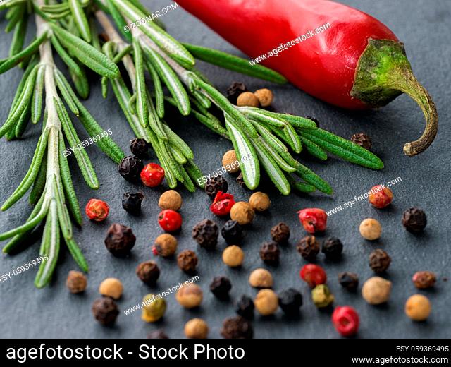 Herbs and spices over slate background. Top view or flat lay. Food background