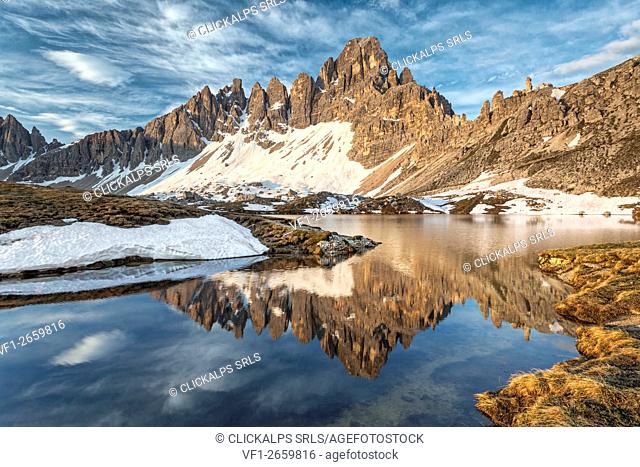 Europe, Italy, South Tyrol, Bolzano. Monte Paterno (Paternkofel) and Crode of Piani reflected in the waters of the Lakes of Piani (Bodenseen) in a spring...