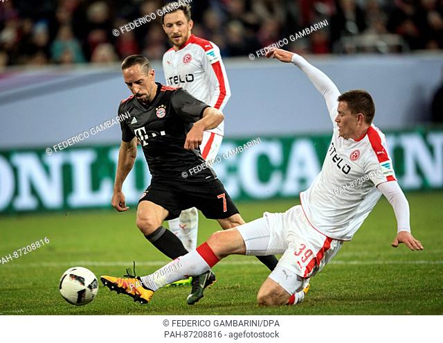 Bayern's Franck Ribery (L) and Duesseldorf's Alexander Madlung vie for the ball during the Telekom Cup soccer match between Fortuna Duesseldorf and Bayern...